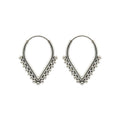 Pair of v-shaped silver hoop earrings with bead detailing on a white background