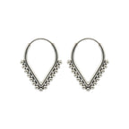 Pair of v-shaped silver hoop earrings with bead detailing on a white background