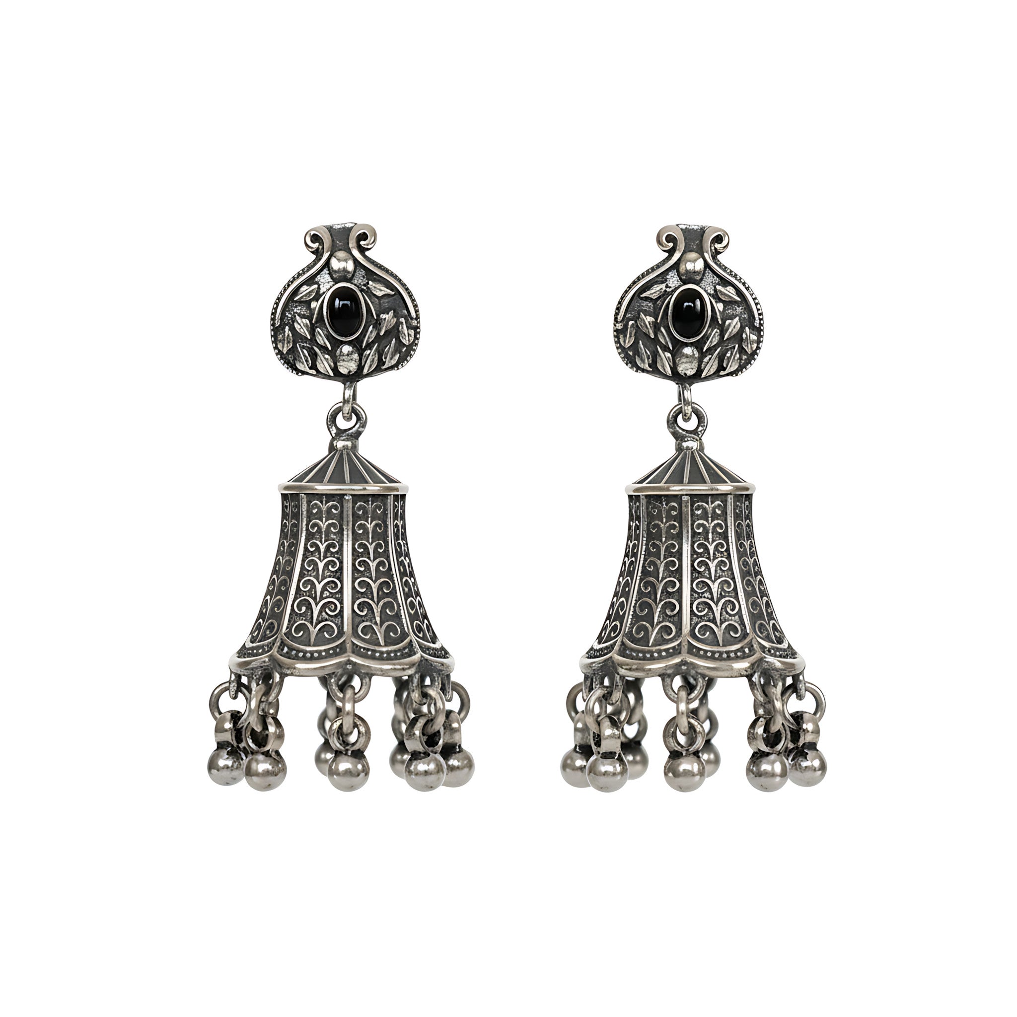 Pair of oxidized silver jhumka earrings with black gemstones on a white background