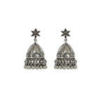 Pair of oxidized silver jhumka earrings on a white background