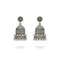 Pair of small oxidized silver jhumka earrings on a white background