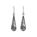Pair of hammered oxidized silver teardrop earrings with spiral designs on a white background