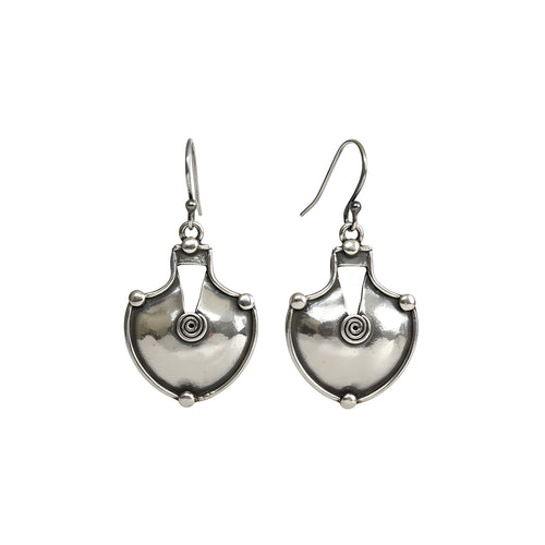 Pair of shield shaped oxidized silver dangle earrings on a white background