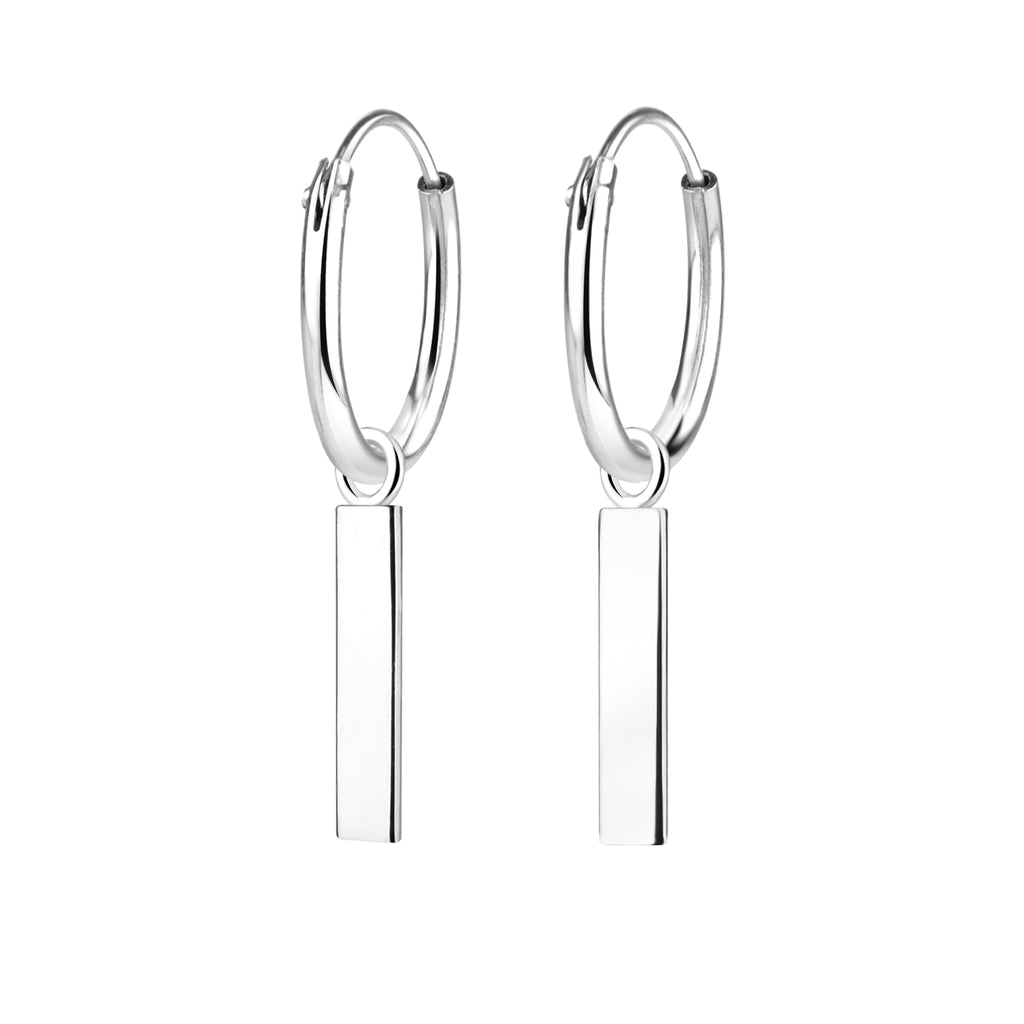 Silver hoop earrings with bar charms on a white background