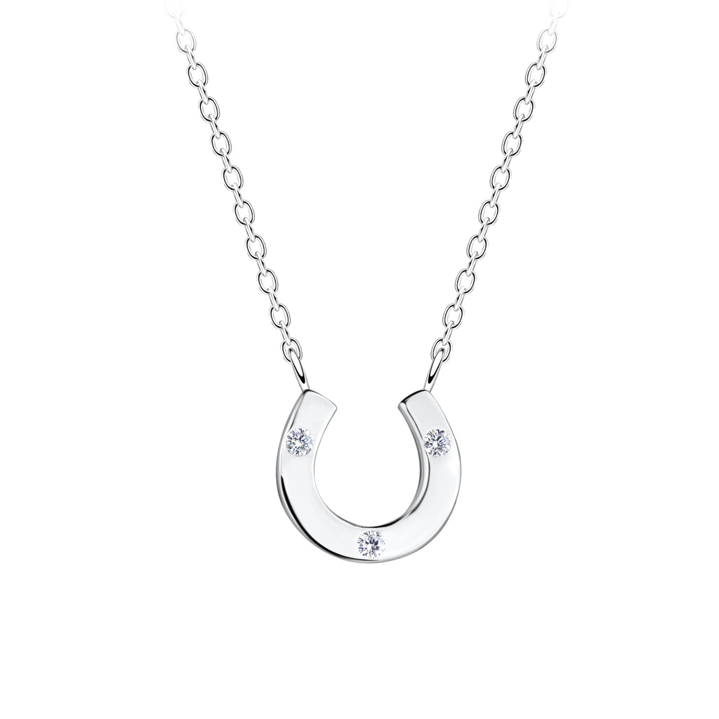 Silver horseshoe necklace with small CZ stones on a white background