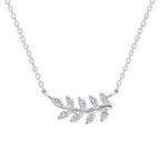Silver necklace with olive leaf pendant with CZ stones on a white background
