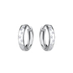 Pair of silver hoop earrings with star shaped CZ stones on a white background