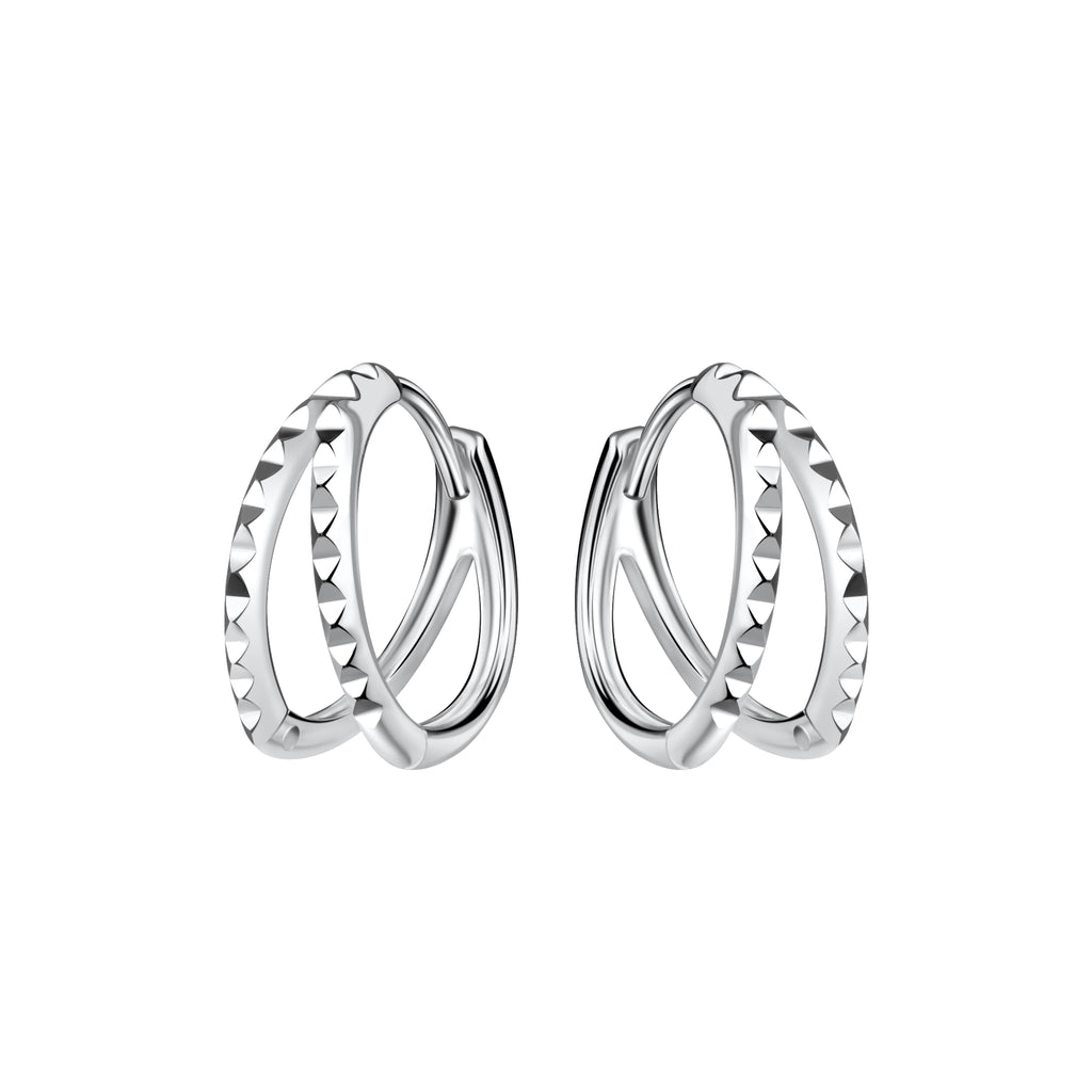 Pair of silver double spiked shaped hoop earrings on a white background