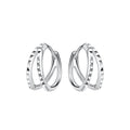 Pair of silver double spiked shaped hoop earrings on a white background