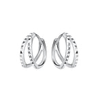 Pair of silver double spiked shaped hoop earrings on a white background