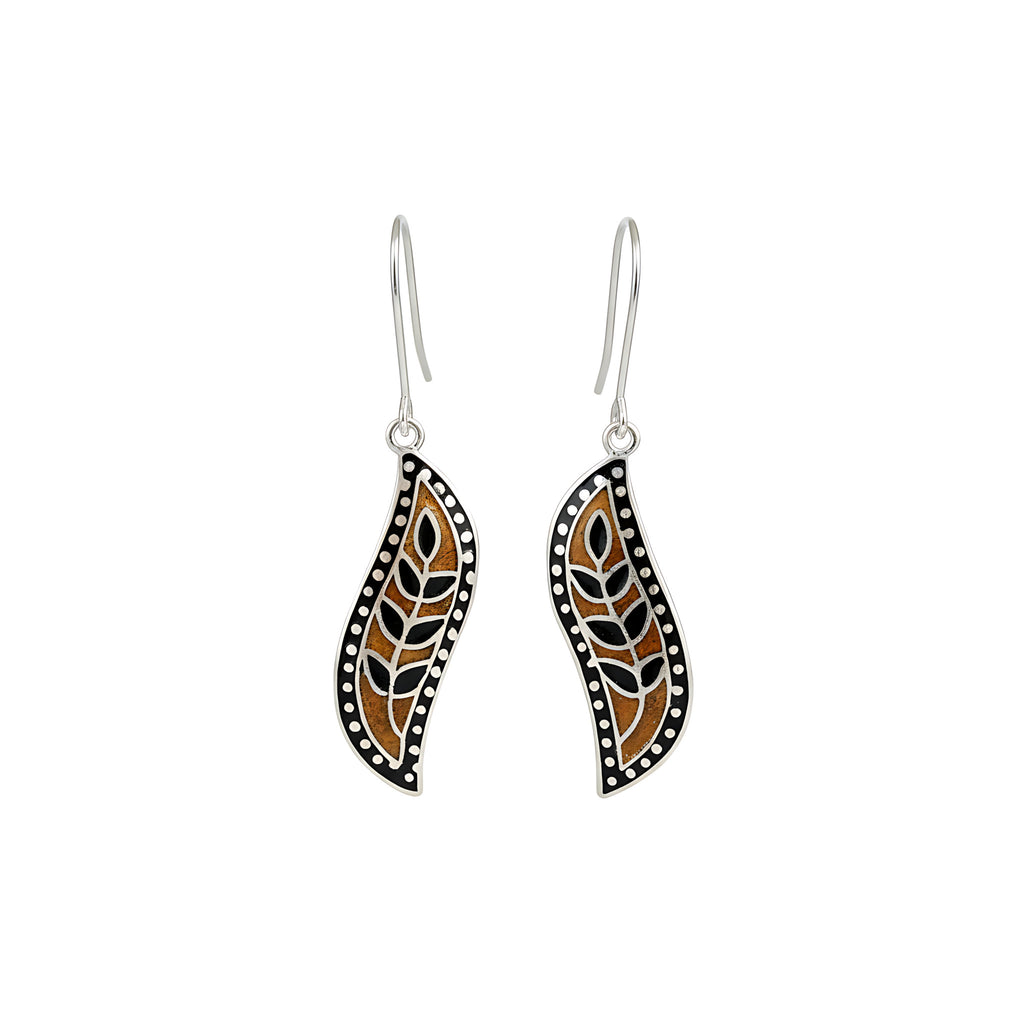 Pair of enamel silver earrings with black and brown design on a white background