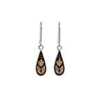 Droplet-shaped enamel silver earrings with floral design on a white background