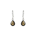 Dewdrop-shaped silver enamel earrings with black and yellow floral designs on a white background
