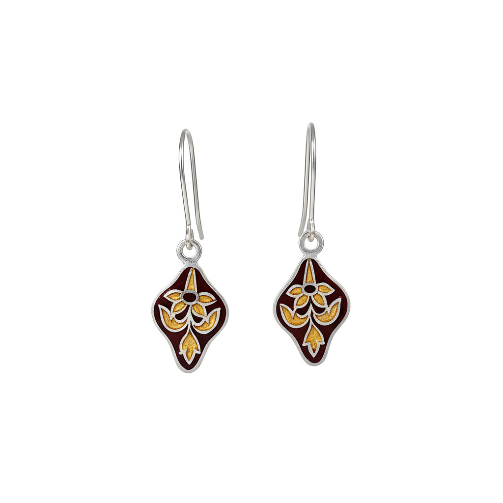 Pair of diamond-shaped silver enamel earrings with floral design on a white background