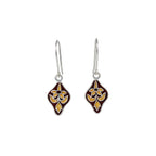Pair of diamond-shaped silver enamel earrings with floral design on a white background