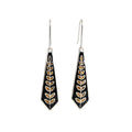 Pair of black silver enamel earrings with gold leaf patterns on a white background