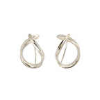 Pair of modern shiny silver dangle earrings on a white background