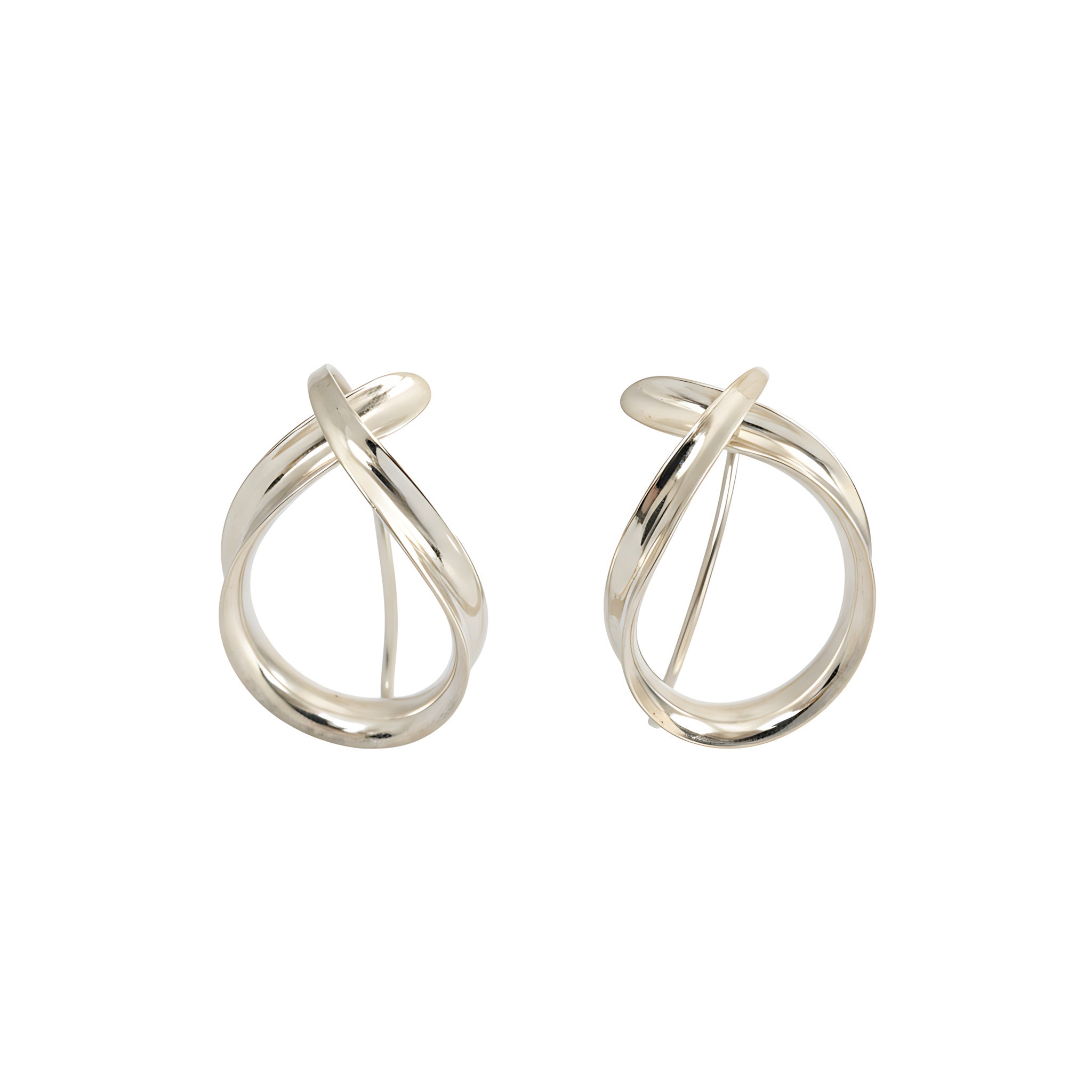 Pair of modern shiny silver dangle earrings on a white background