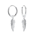 Silver hoop earrings with leaf-shaped charms on a white background
