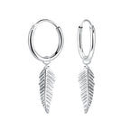 Silver hoop earrings with leaf-shaped charms on a white background