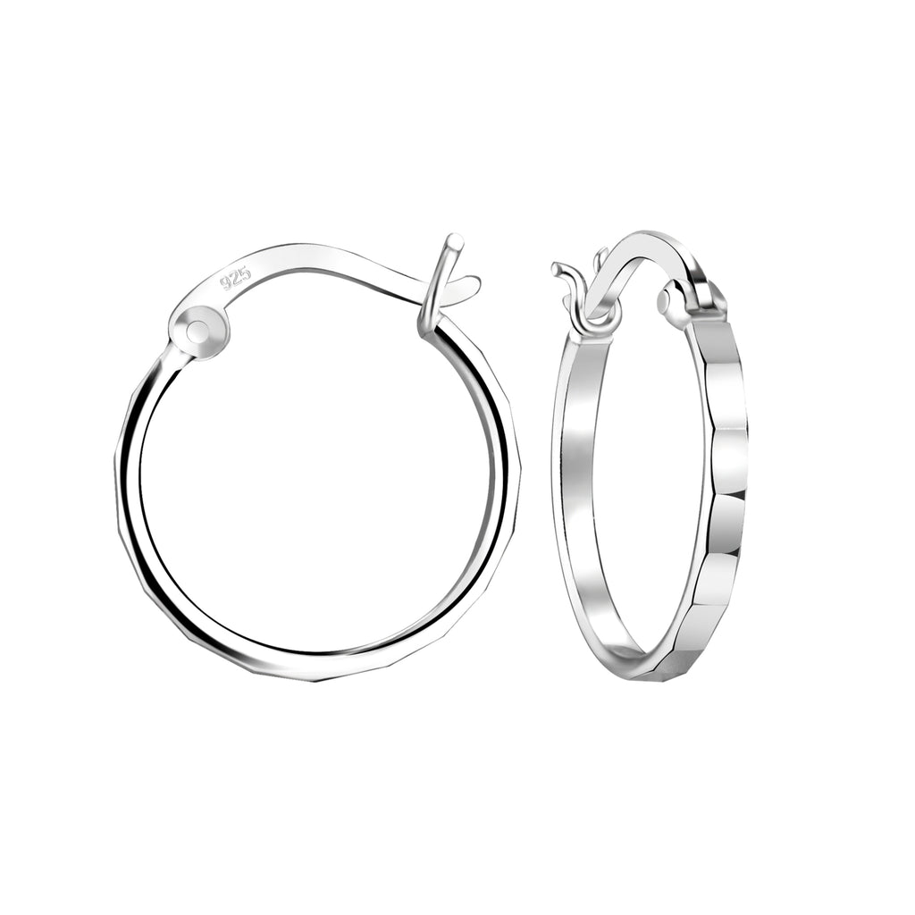 Hammered silver French lock hoop earrings on a white background
