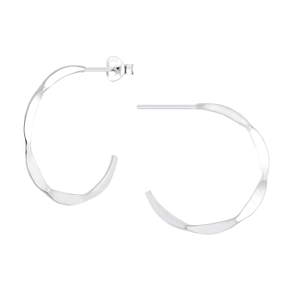 Silver hammered half hoop stud earrings on a white background