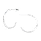 Silver hammered half hoop stud earrings on a white background