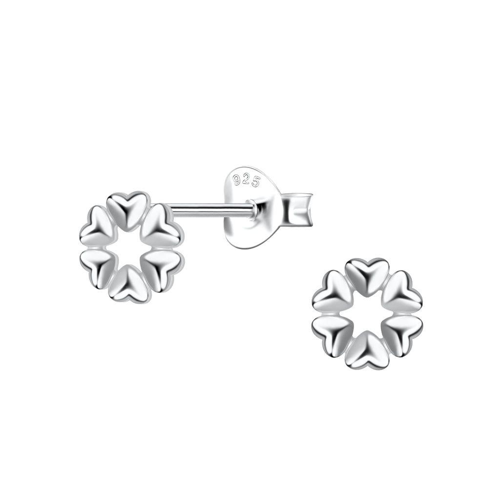 Silver heart shaped stud earrings on a white background