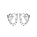 Pair of leaf shaped silver huggie hoop earrings on a white background