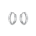 Pair of silver hoop earrings with spiked design on a white background
