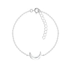Silver bracelet with a crescent moon charm on a white background