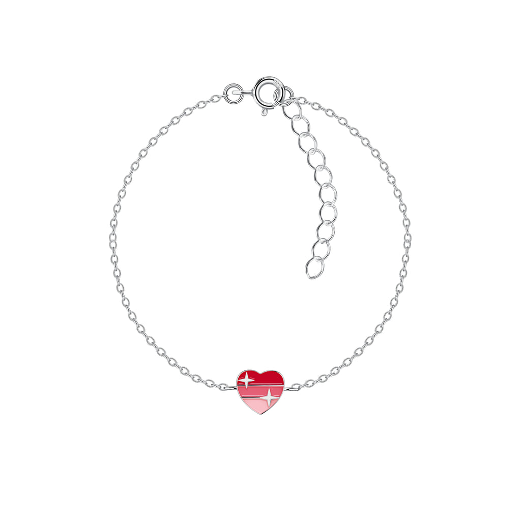 Silver bracelet with a red heart-shaped charm on a white background