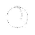 Silver satellite bracelet with small beads on a white background