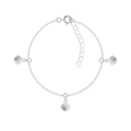 Silver bracelet with 3 shell charms on a white background