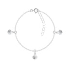 Silver bracelet with 3 shell charms on a white background