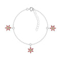 Silver bracelet with snowflake charms on a white background