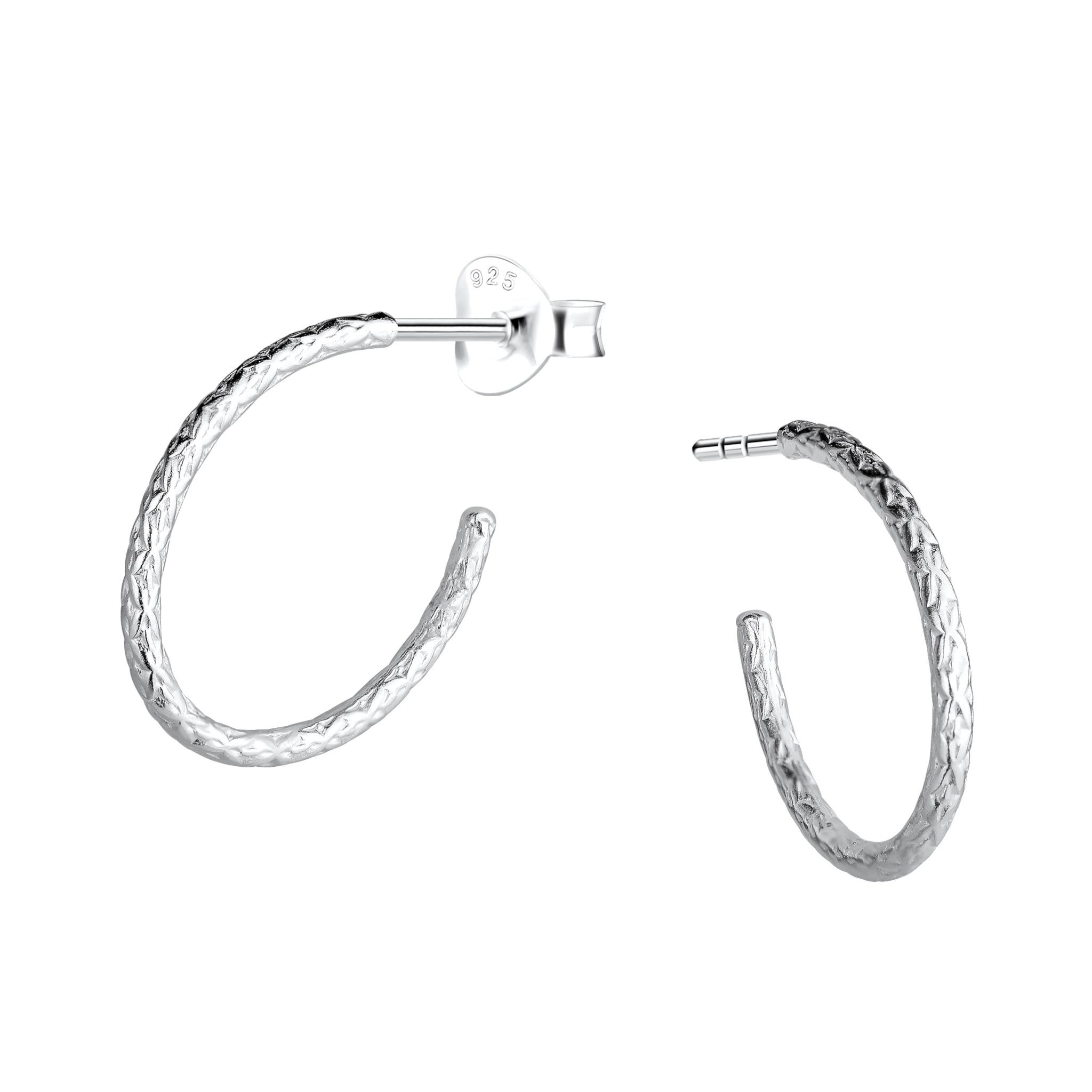 Textured silver half hoop stud earrings on a white background