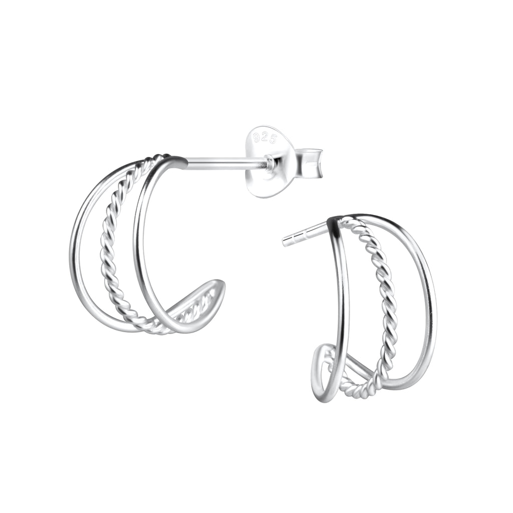 Triple band silver half hoop stud earrings on a white background