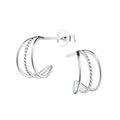 Triple band silver half hoop stud earrings on a white background