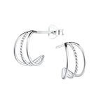 Triple band silver half hoop stud earrings on a white background