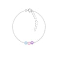 Silver bracelet with triple daisy flower-shaped charms on a white background