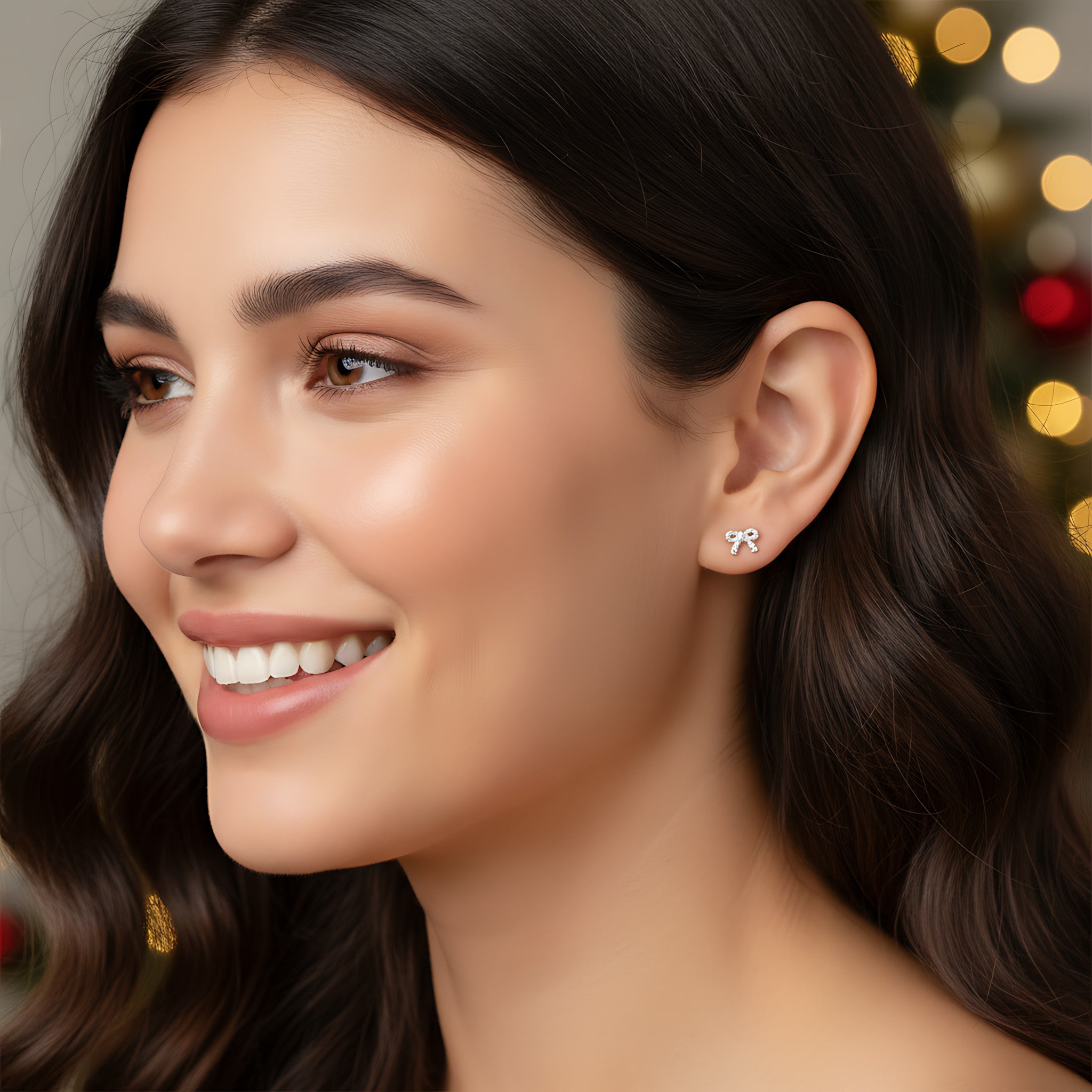 Close-up of a woman wearing twisted bow shape silver stud earring with a blurred festive background