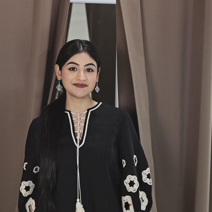 A beautiful female showcasing heritage silver earrings.