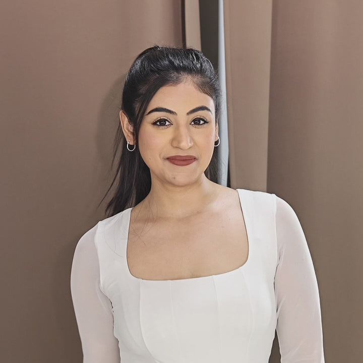 A beautiful female showcasing everyday silver earrings.